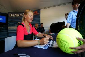 Maria Sharapova giving autographs