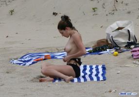 Kelly Brook sunbathing topless