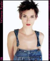 Winona Ryder posing in dungarees