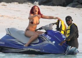 Rihanna in bikini on water scooter