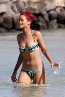 Rihanna in bikini with drink