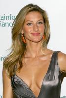 Gisele Bundchen smiling in silver dress - bossom