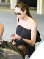 20889_Celebutopia-Angelina_Jolie_taking_daughters_to_a_kid_center_in_a_mall_in_LA-03_122_542lo.JPG
