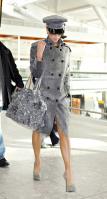 98082_Celebutopia-Victoria_Beckham_at_Heathrow_Airport-06_122_4lo.jpg