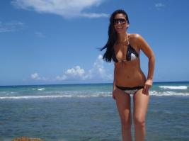 Olivia Munn in bikini by the sea