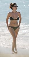 94211646_79274_Kelly_Brook__Caribbean_beach_012707_7_122_326lo.jpg