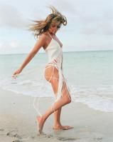 Jennifer Lopez walking on a seaside in fancy dress