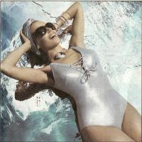 Kylie Minogue sunbathing in swimsuit