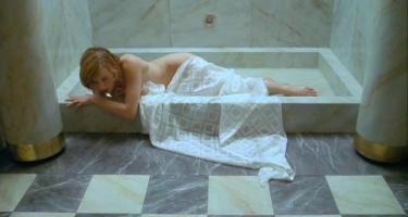Milla Jovovich naked under shower