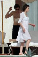 87719_233649d1263571764_milla_jovovich_white_see_thru_dress_white_bikini_beach_los_cabos_1_5_10_mj_4__122_337lo.jpg