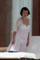 87725_233650d1263571764_milla_jovovich_white_see_thru_dress_white_bikini_beach_los_cabos_1_5_10_mj_5__122_519lo.jpg