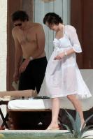 87838_233660d1263571795_milla_jovovich_white_see_thru_dress_white_bikini_beach_los_cabos_1_5_10_mj_15__122_566lo.jpg