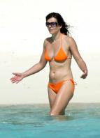 Elizabeth Hurley in orange bikini