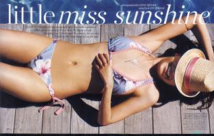 Mila Kunis in hot bikini by the sea