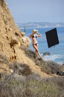 101749924_paris_hilton_black_bikini_candids_La3zicb.jpg