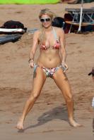 Paris Hilton in bikini on the sand